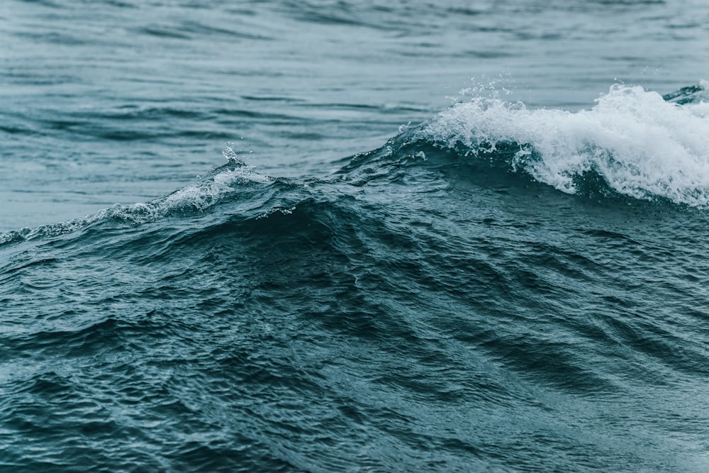 water waves on blue ocean water during daytime