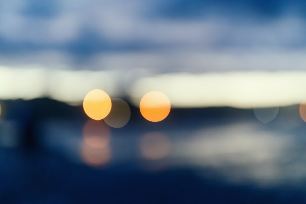 bokeh photography of sun during night time
