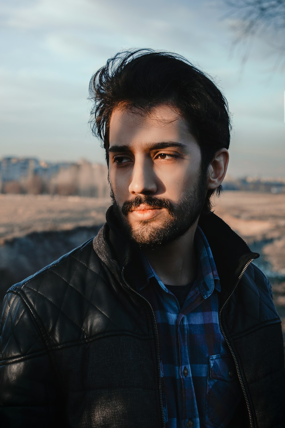 man in black leather jacket