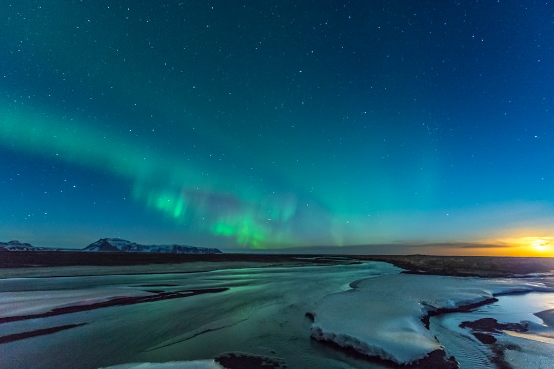 green and blue sky with stars