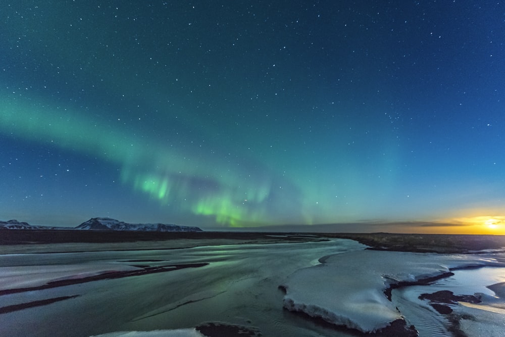 green and blue sky with stars