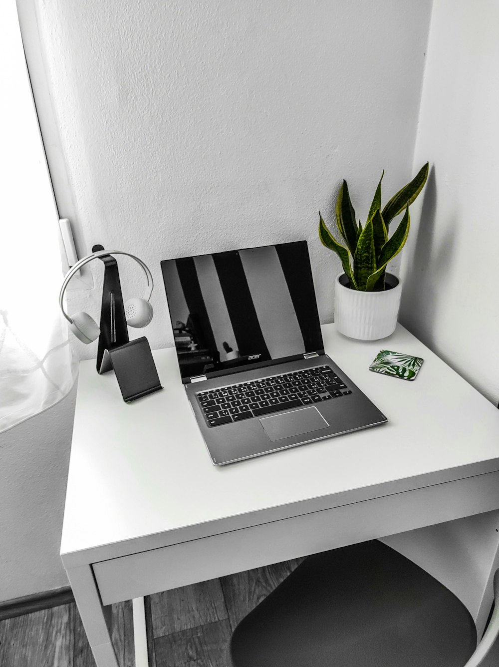 macbook pro on white table