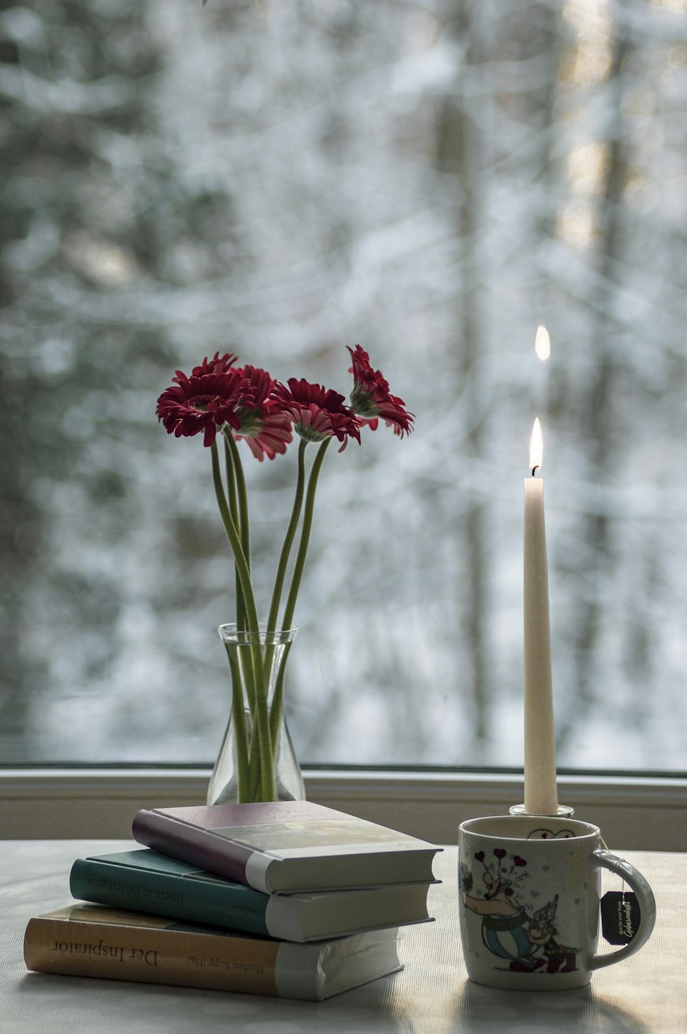 red flower in clear glass vase