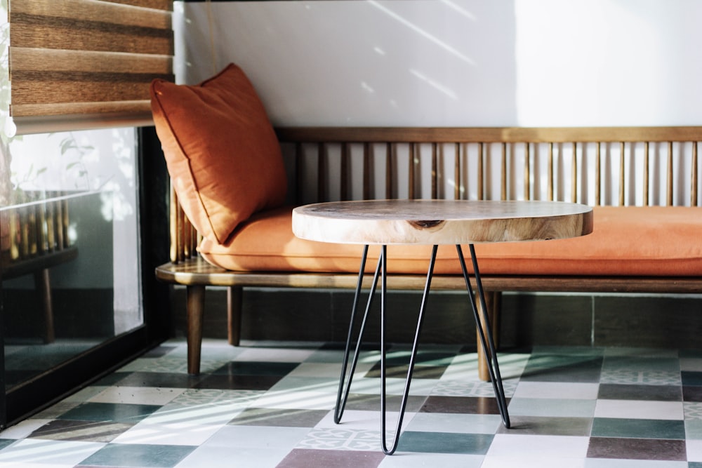 brown wooden table near brown wooden couch