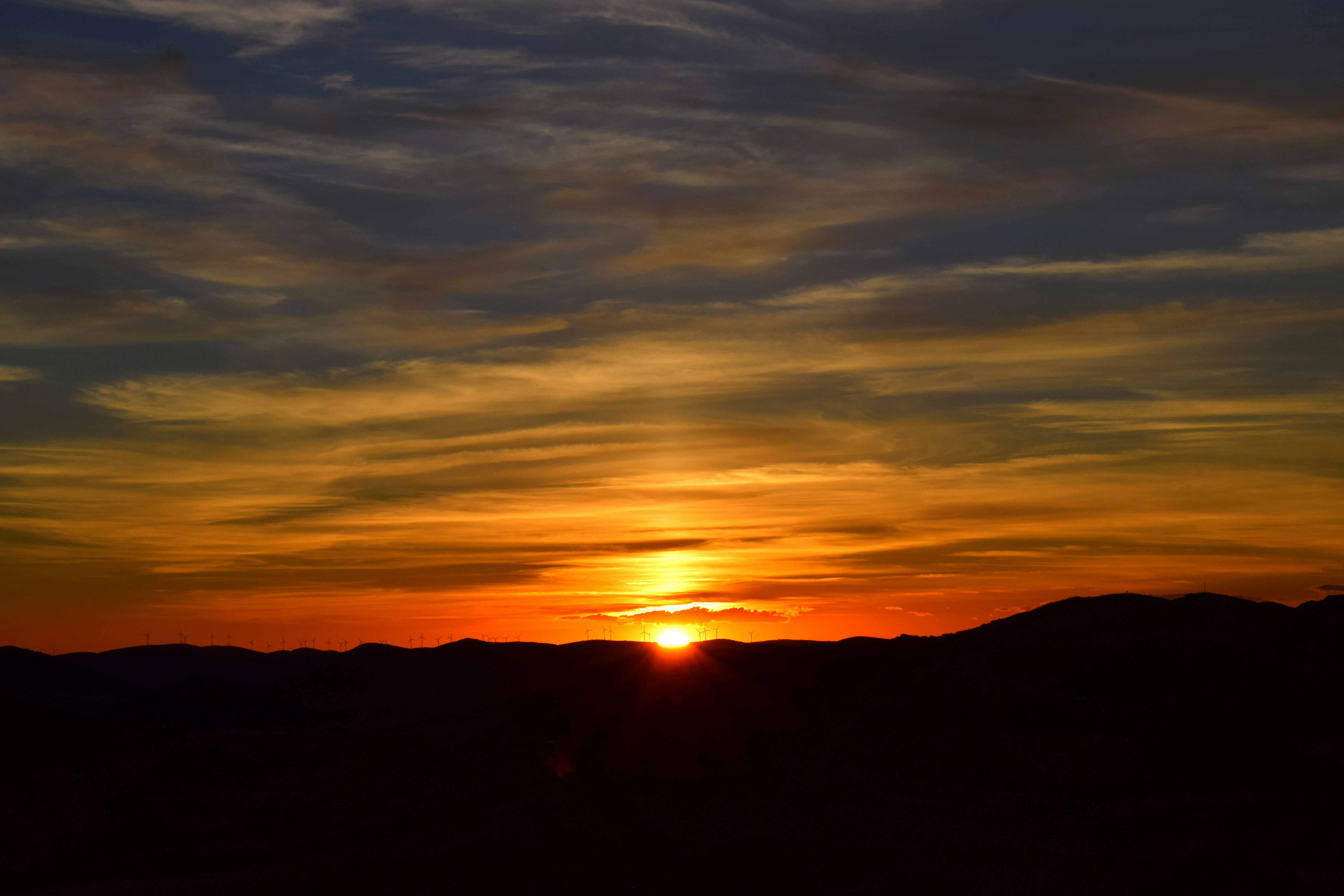 silhouette of mountain during sunset