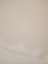 A soft beige abstract background with gentle curved lines and subtle texture.