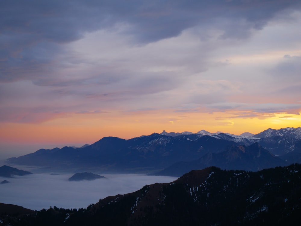 silhouette of mountains during sunset