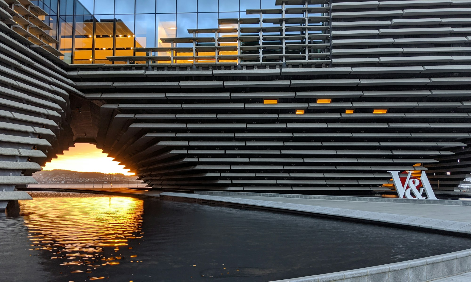 V&A Dundee Design For Business. gray metal frame on body of water during sunset