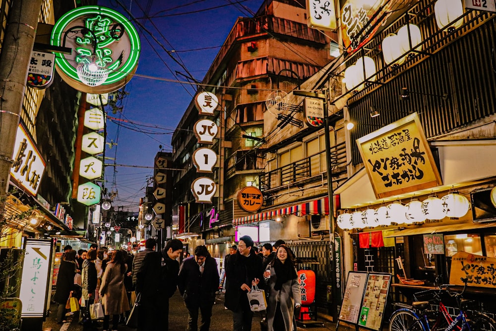 people walking on street during night time