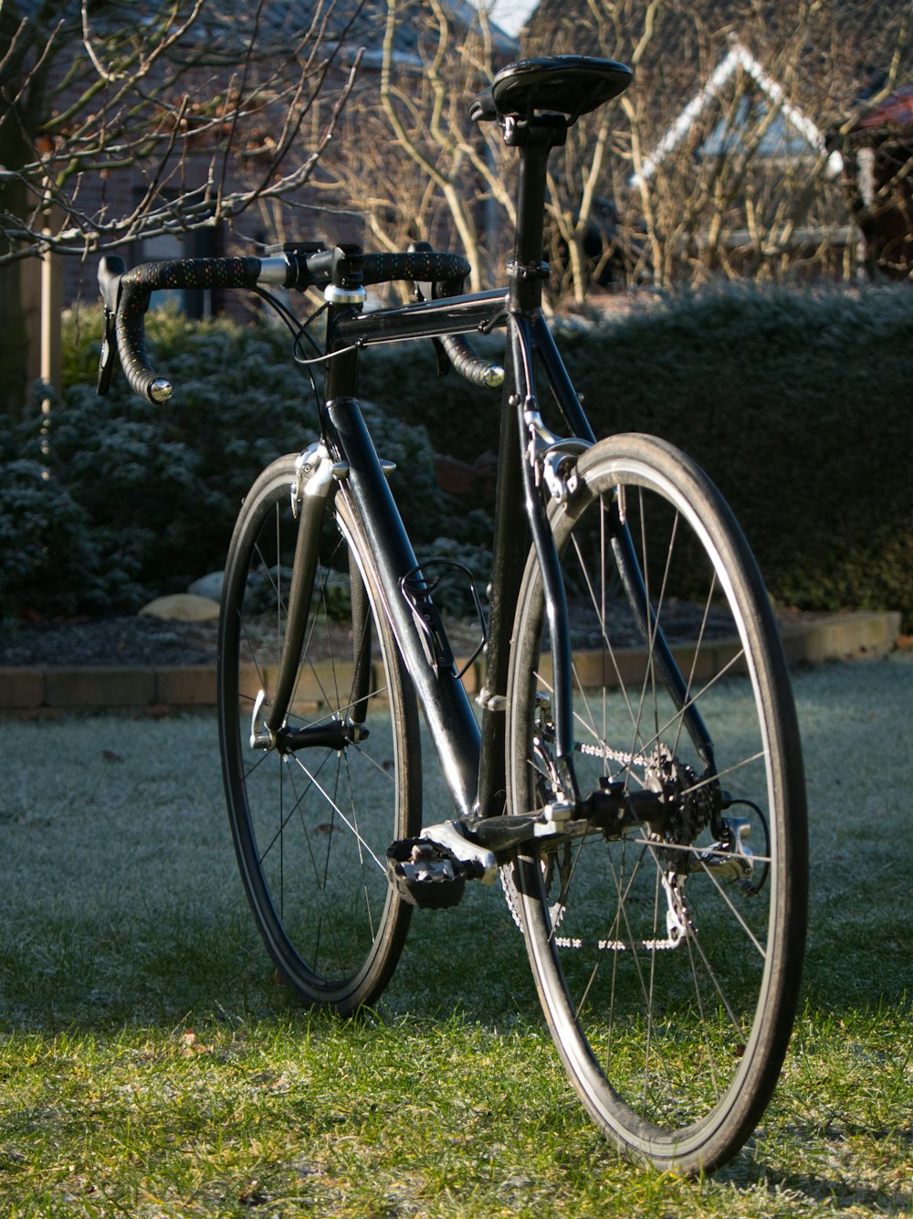 black and silver bicycle on green grass field during daytime