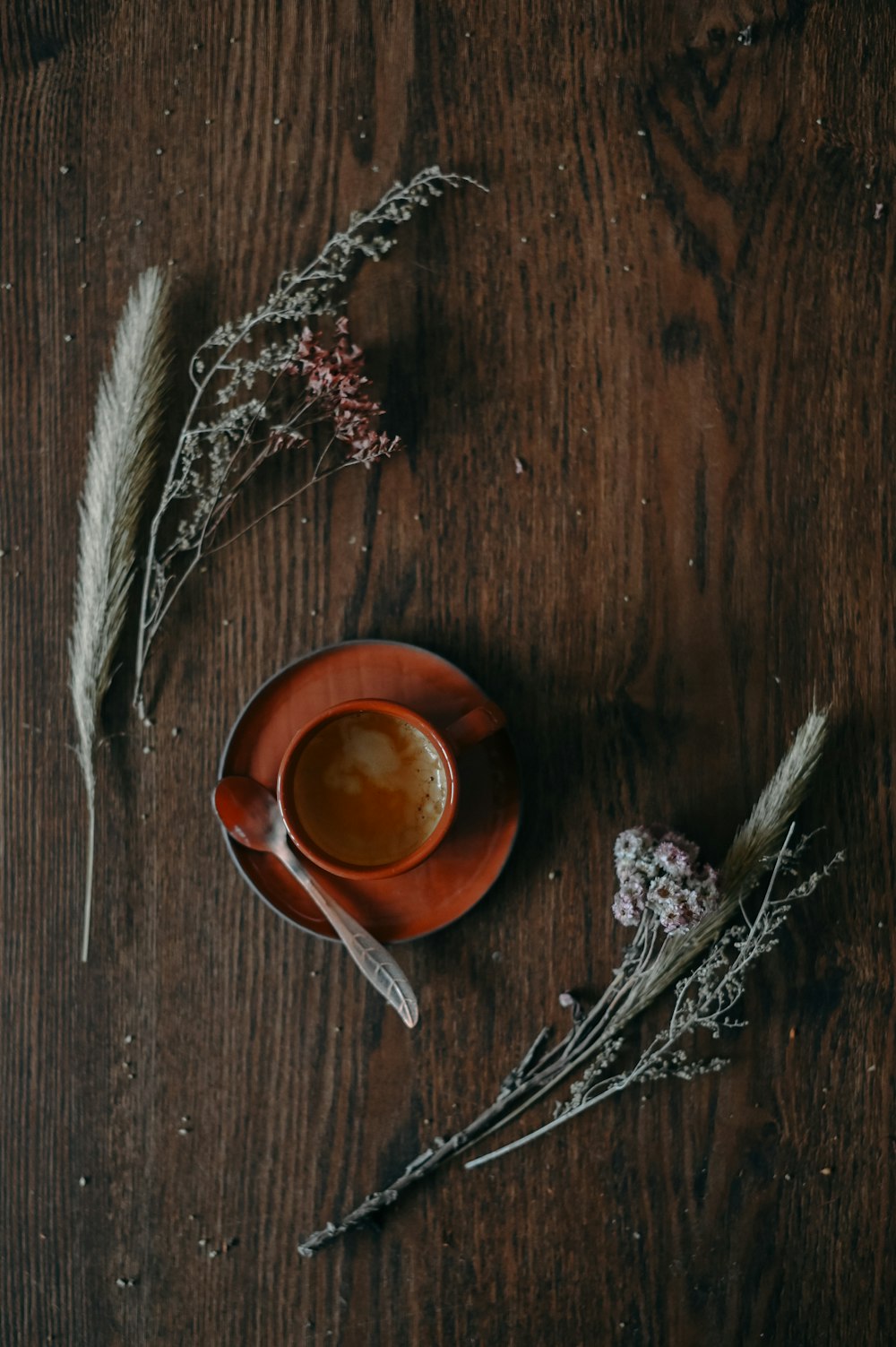 brown ceramic cup with brown liquid inside