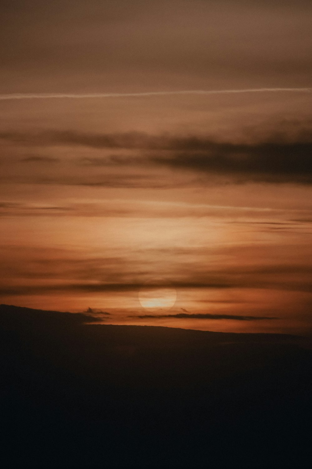 silhouette of mountain during sunset