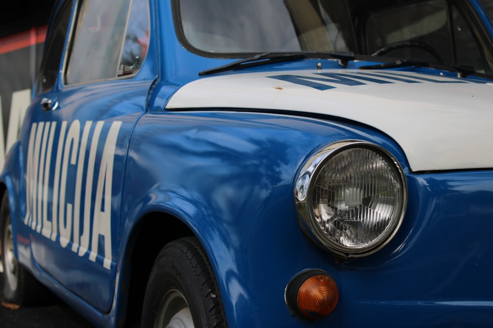 blue and white car with open door