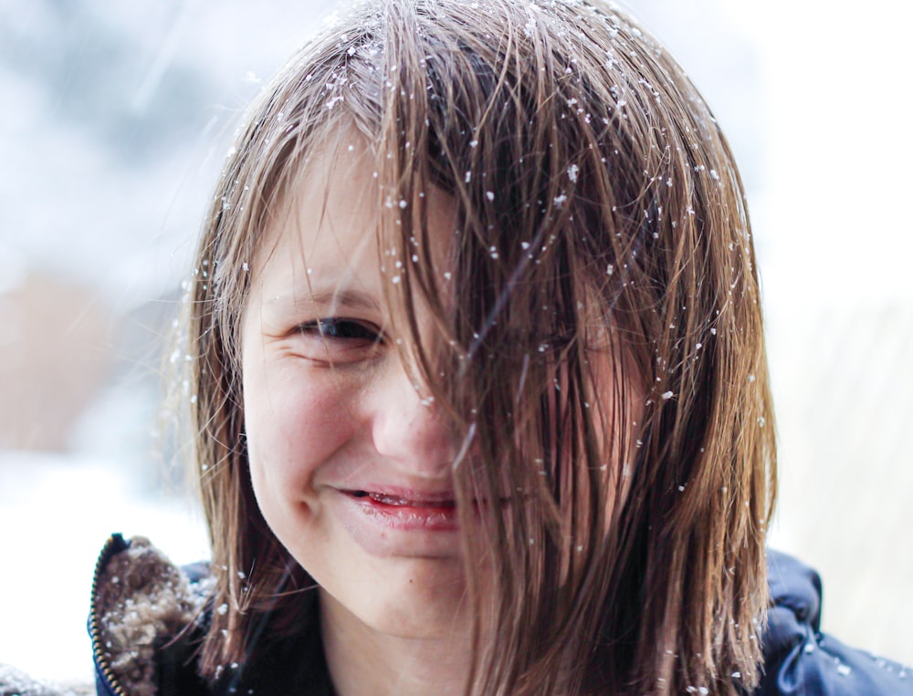 girl in black shirt smiling