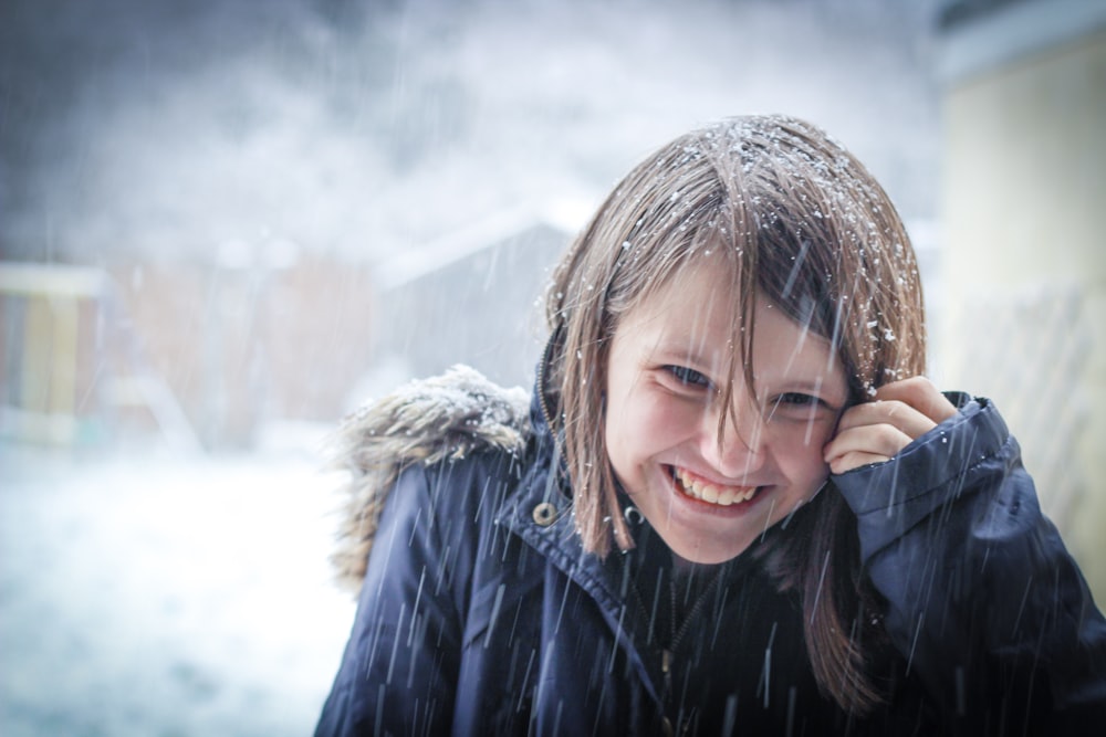 woman in black jacket smiling