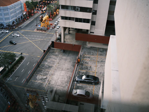 Wide-angle photo capturing a large intersection in Riyadh with new safety barriers and visible markings.
