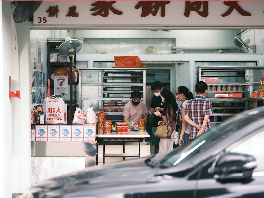 people standing in front of store during daytime