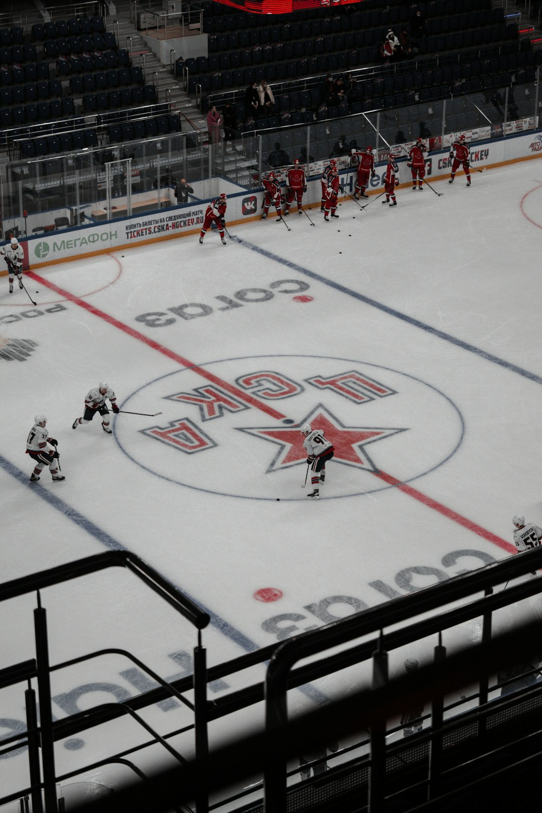 people playing ice hockey on ice field