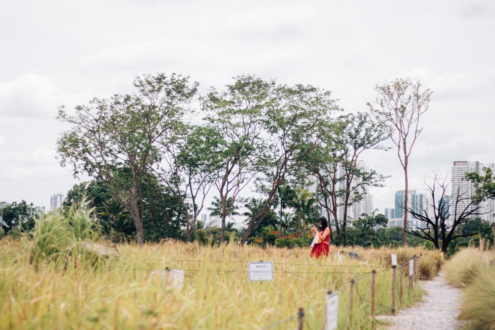 people walking on green grass field during daytime