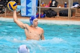 man in blue swimming goggles