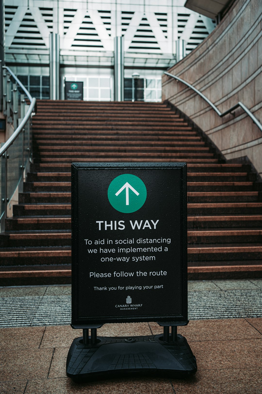 black and white wooden signage on brown concrete staircase