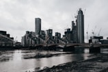City skyline with cranes and construction in progress.
