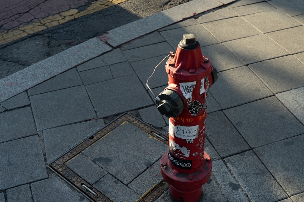 red fire extinguisher on gray brick floor