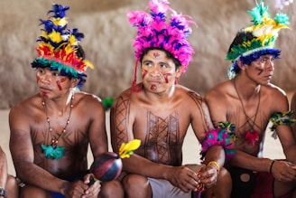 2 women in purple and yellow floral headdress