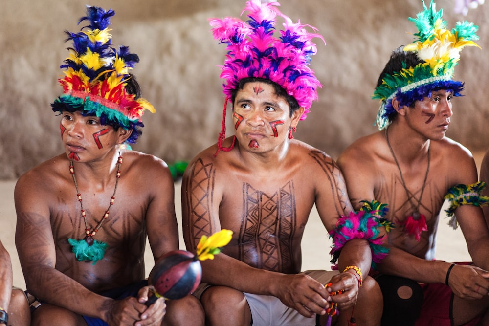 2 women in purple and yellow floral headdress