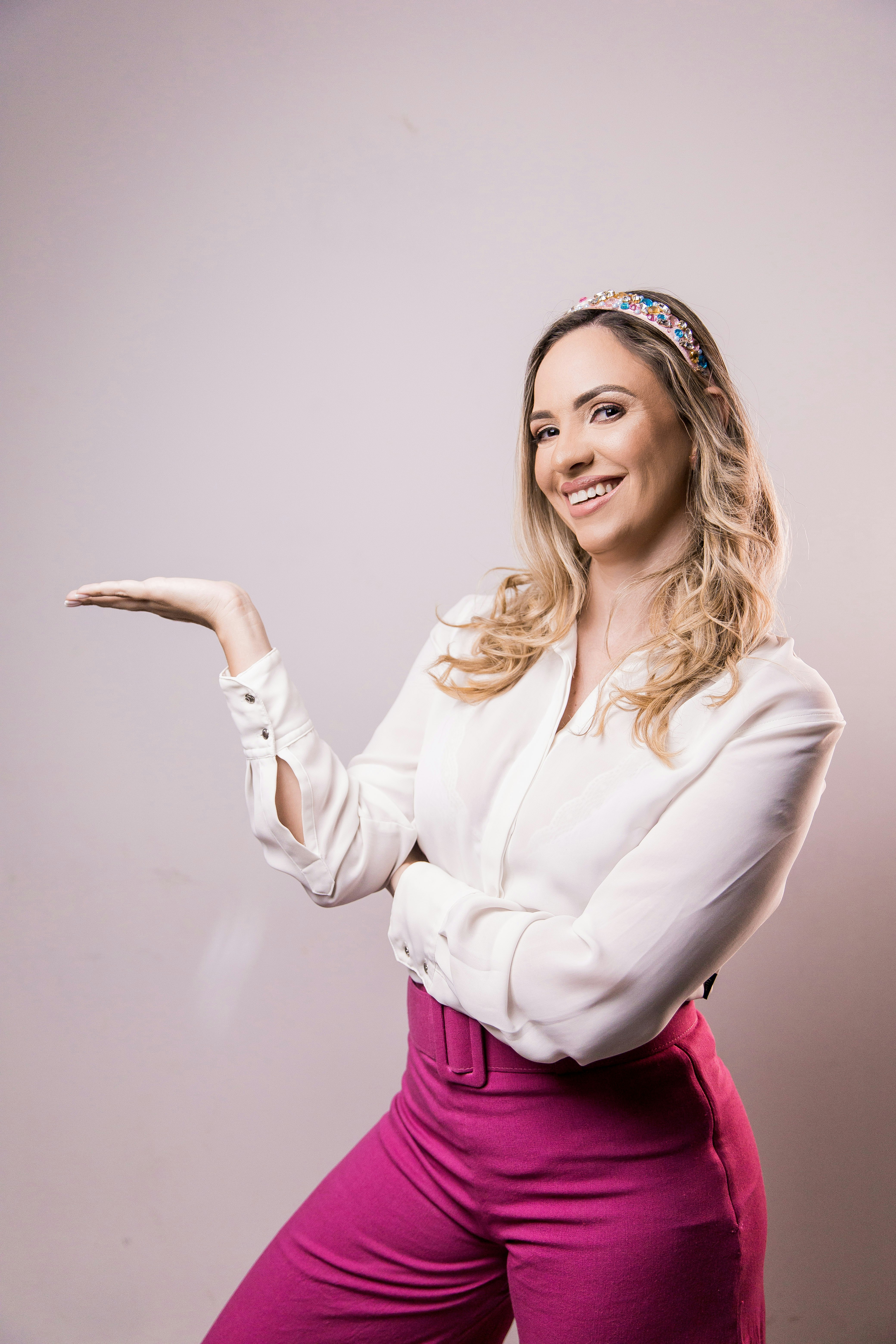 woman in white long sleeve shirt and pink skirt