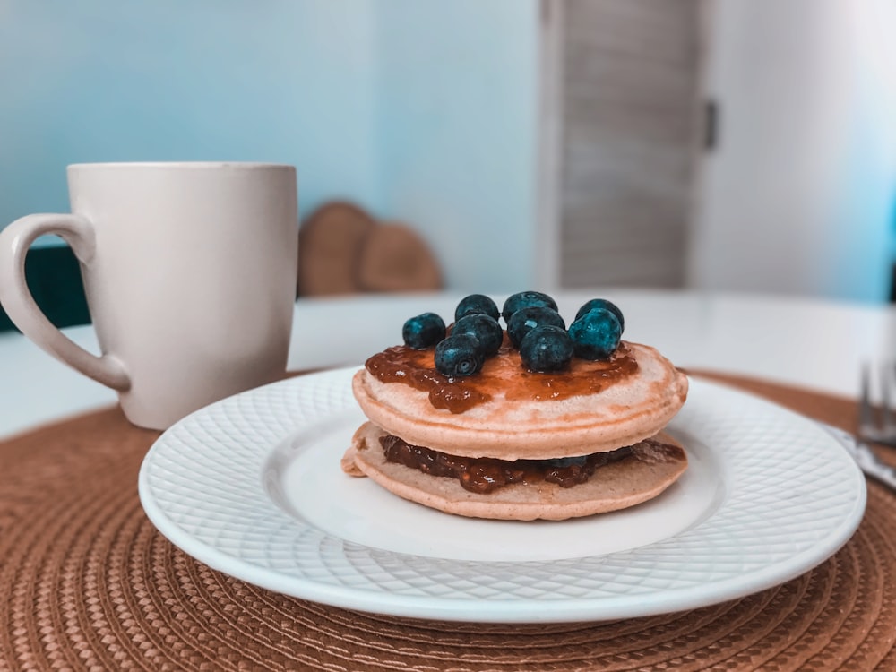 three cupcakes on white ceramic plate