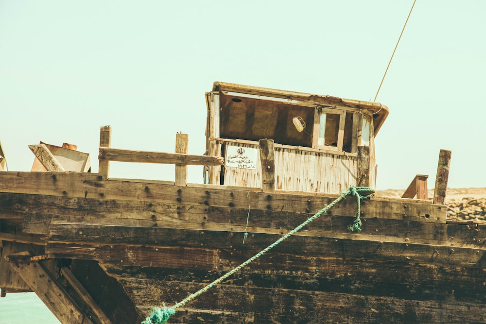 brown and green ship on water during daytime