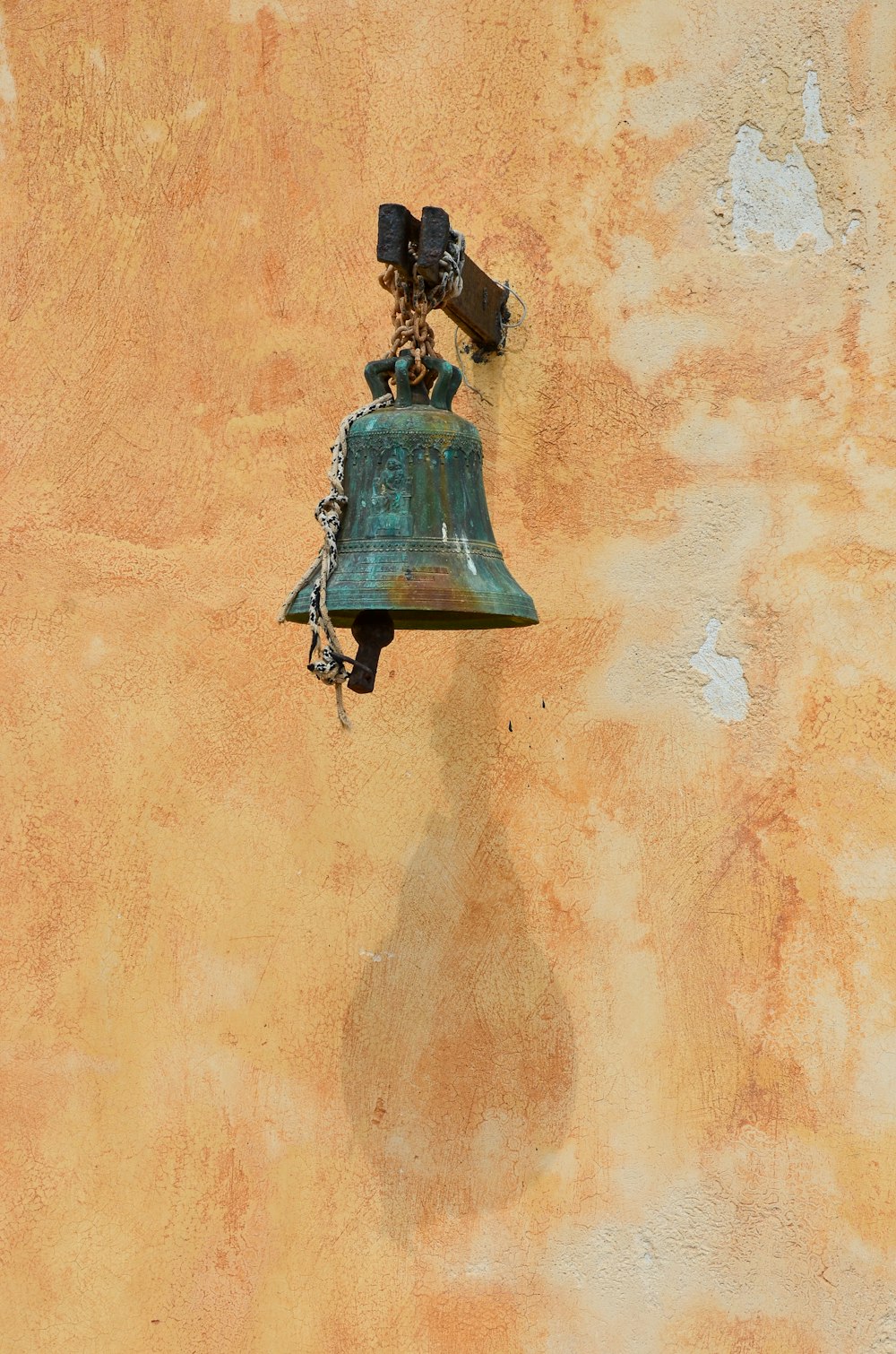 black bell on brown wall