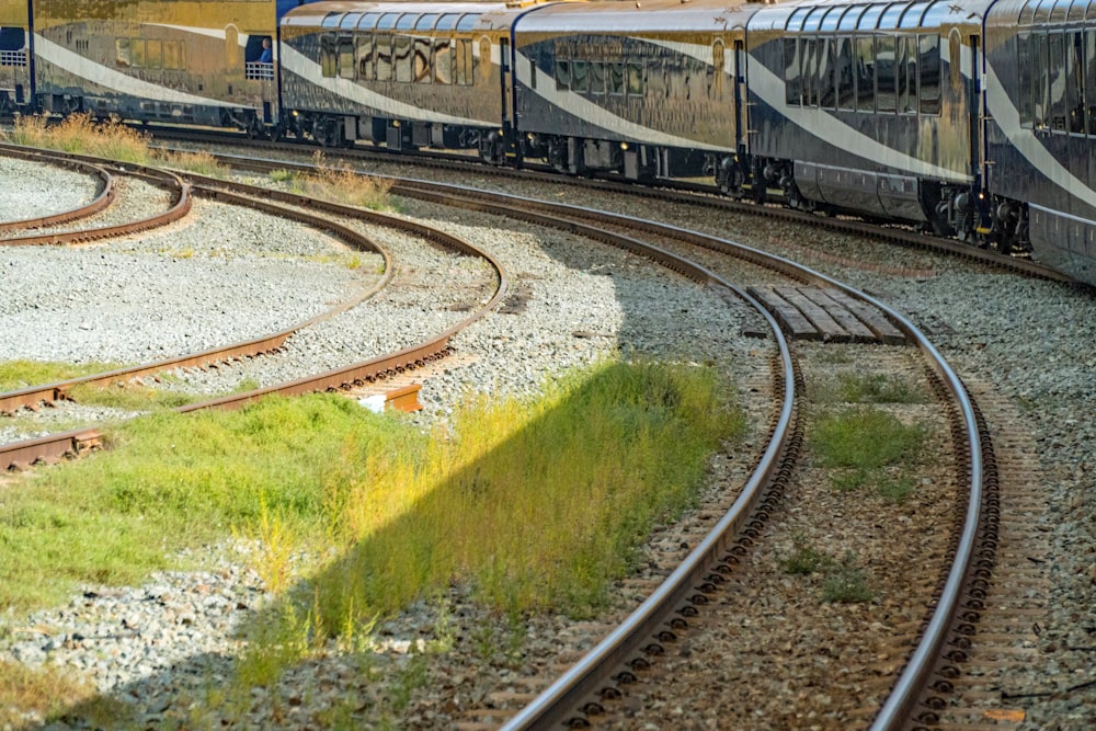 black and gray train on rail tracks