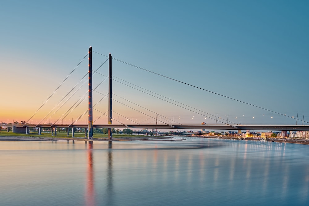 bridge over water under blue sky during daytime