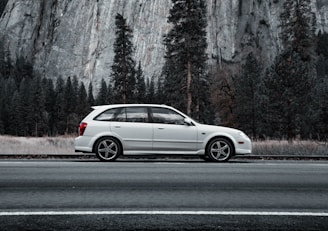 A comfortable car parked at a picturesque travel destination.