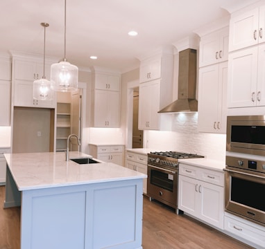 white wooden kitchen cabinet and white wooden kitchen cabinet