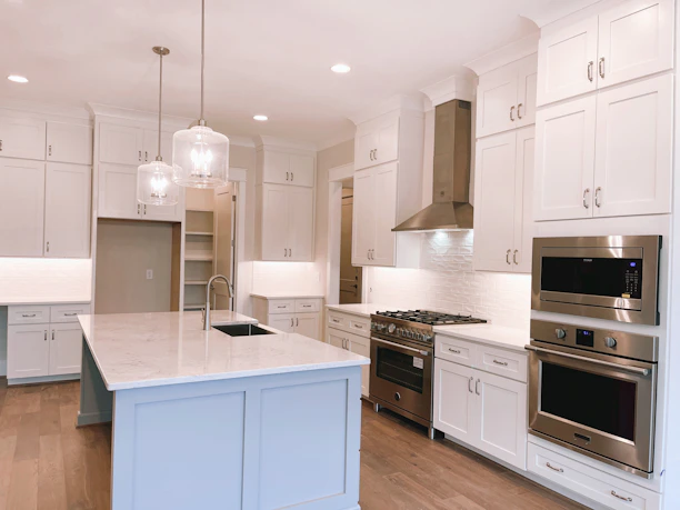white wooden kitchen cabinet and white wooden kitchen cabinet