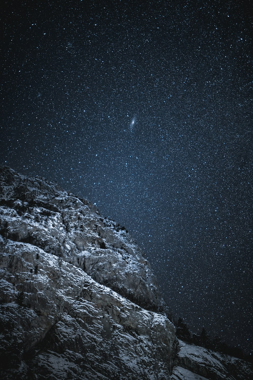 snow covered mountain during night time