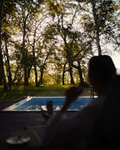 A calm scene of someone enjoying a peaceful moment outdoors, representing balance between money and mental health.