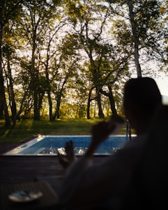 A serene morning scene with a person enjoying a healthy lifestyle outdoors, symbolizing balance and vitality.