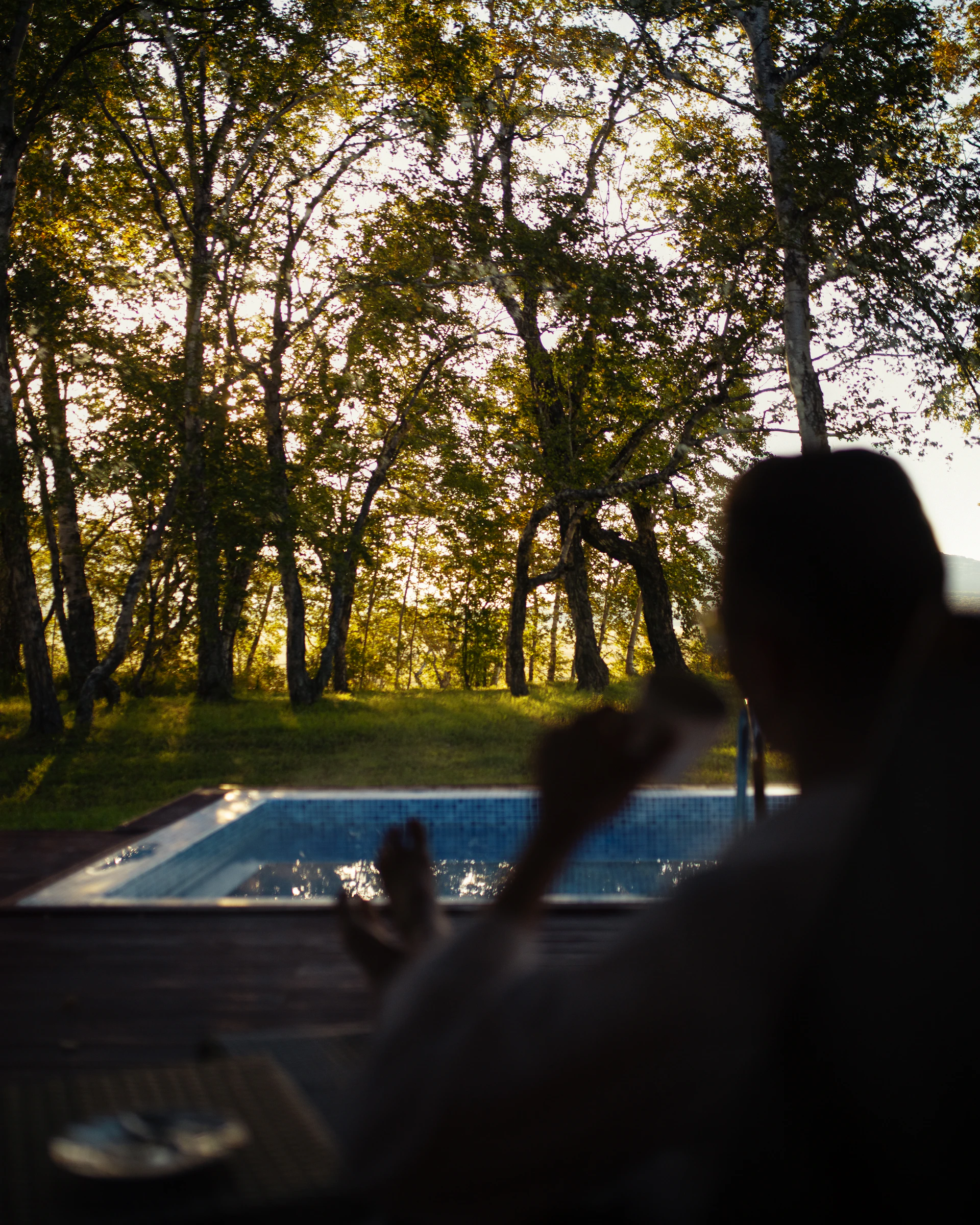 woman wearing yellow long-sleeved dress under white clouds and blue sky during daytime