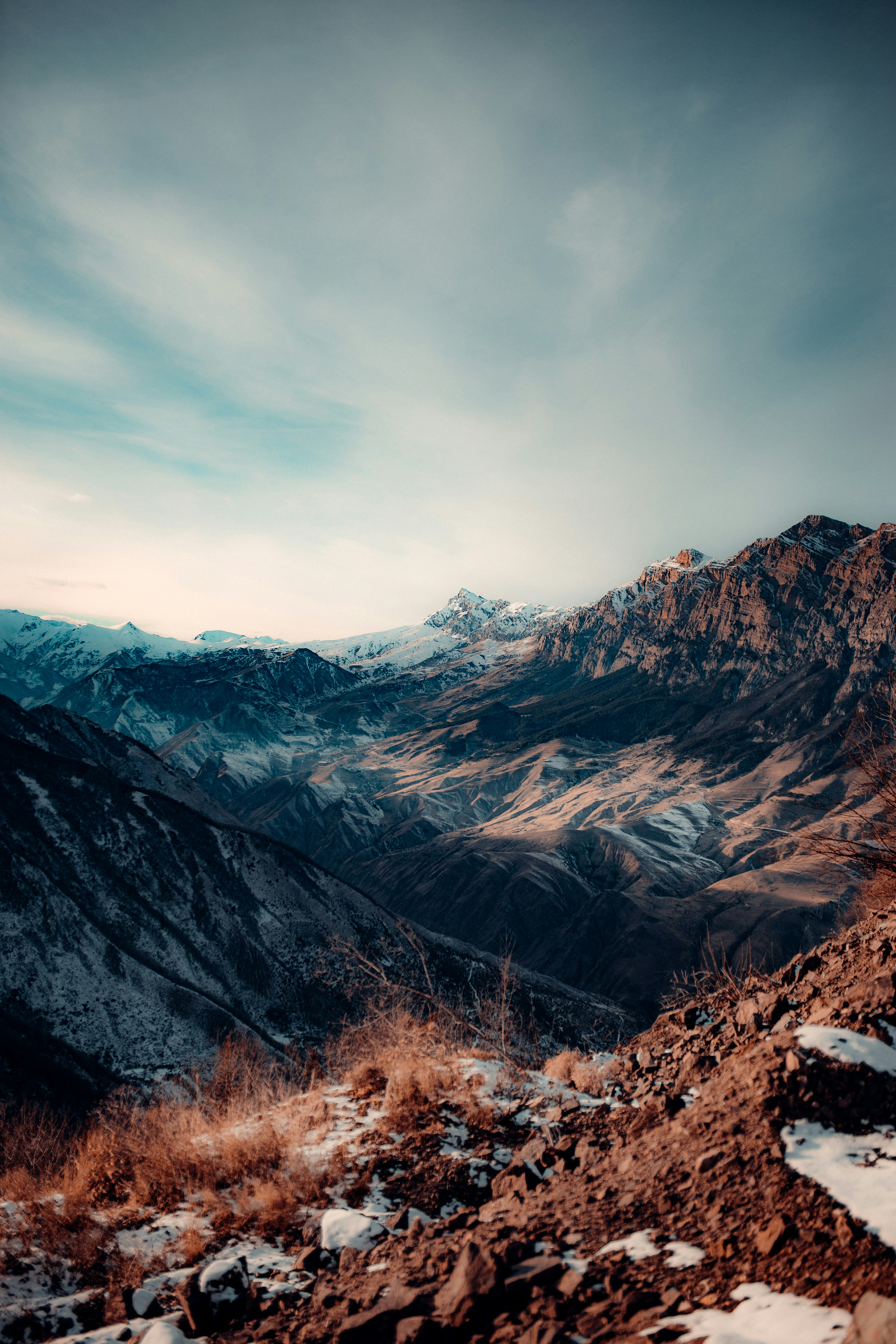 brown and gray mountains under gray sky