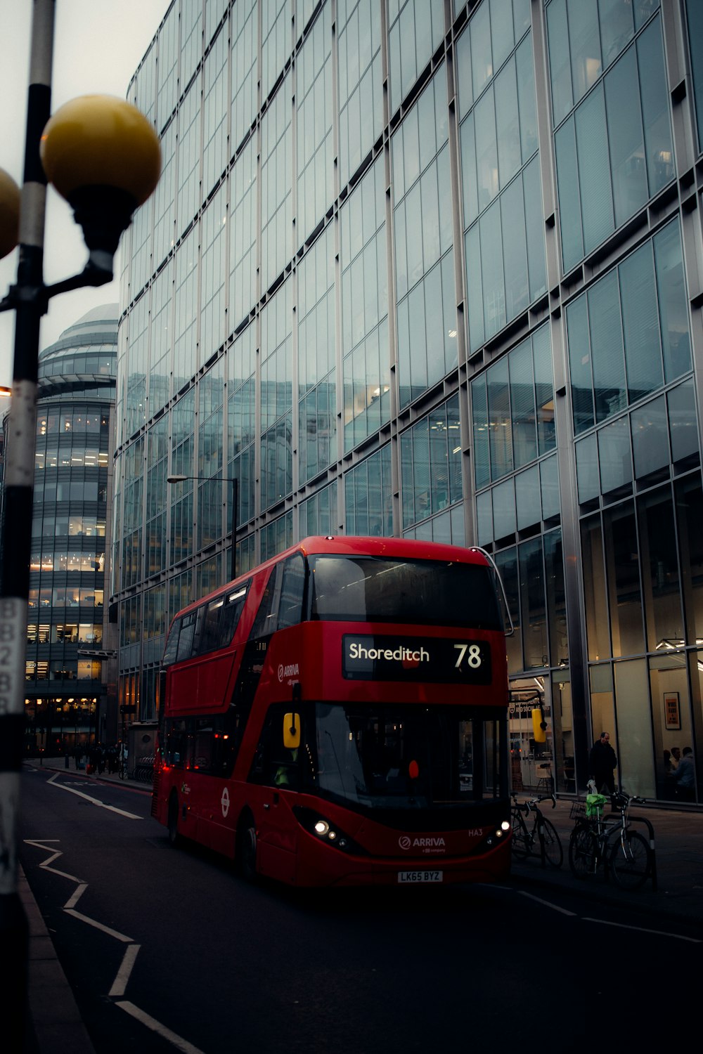 red double decker bus on road during daytime