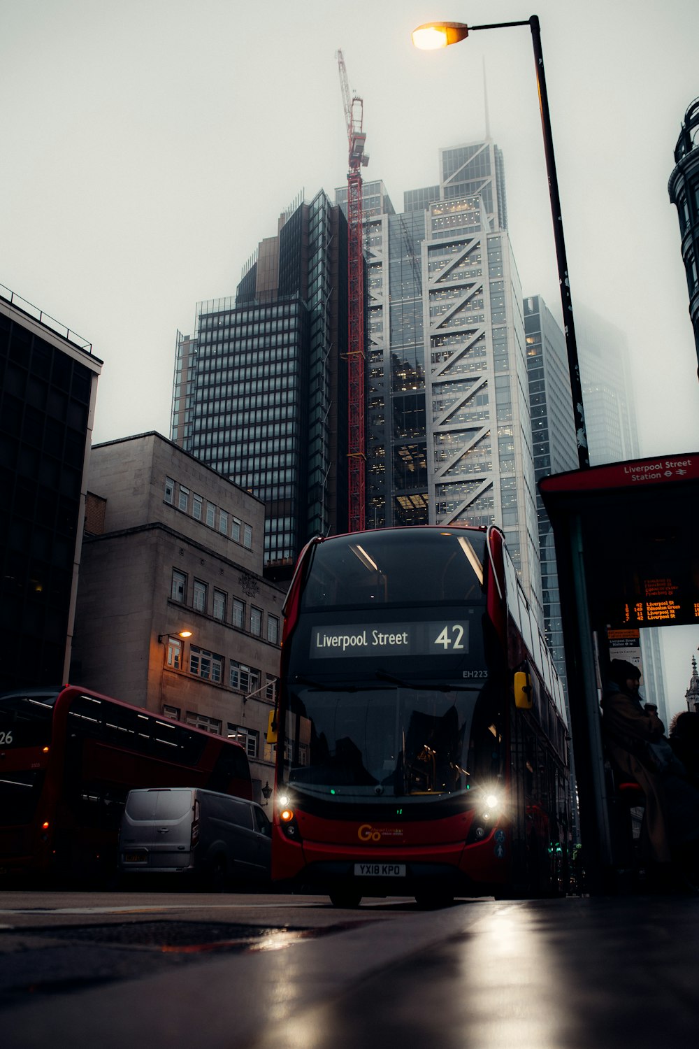 red double decker bus on road during daytime