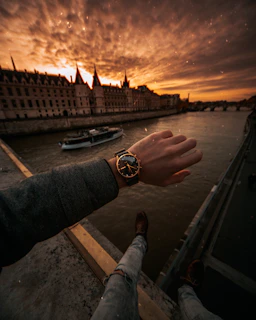 Customer smiling while wearing a vérité luxe watch, with cityscape in the background.
