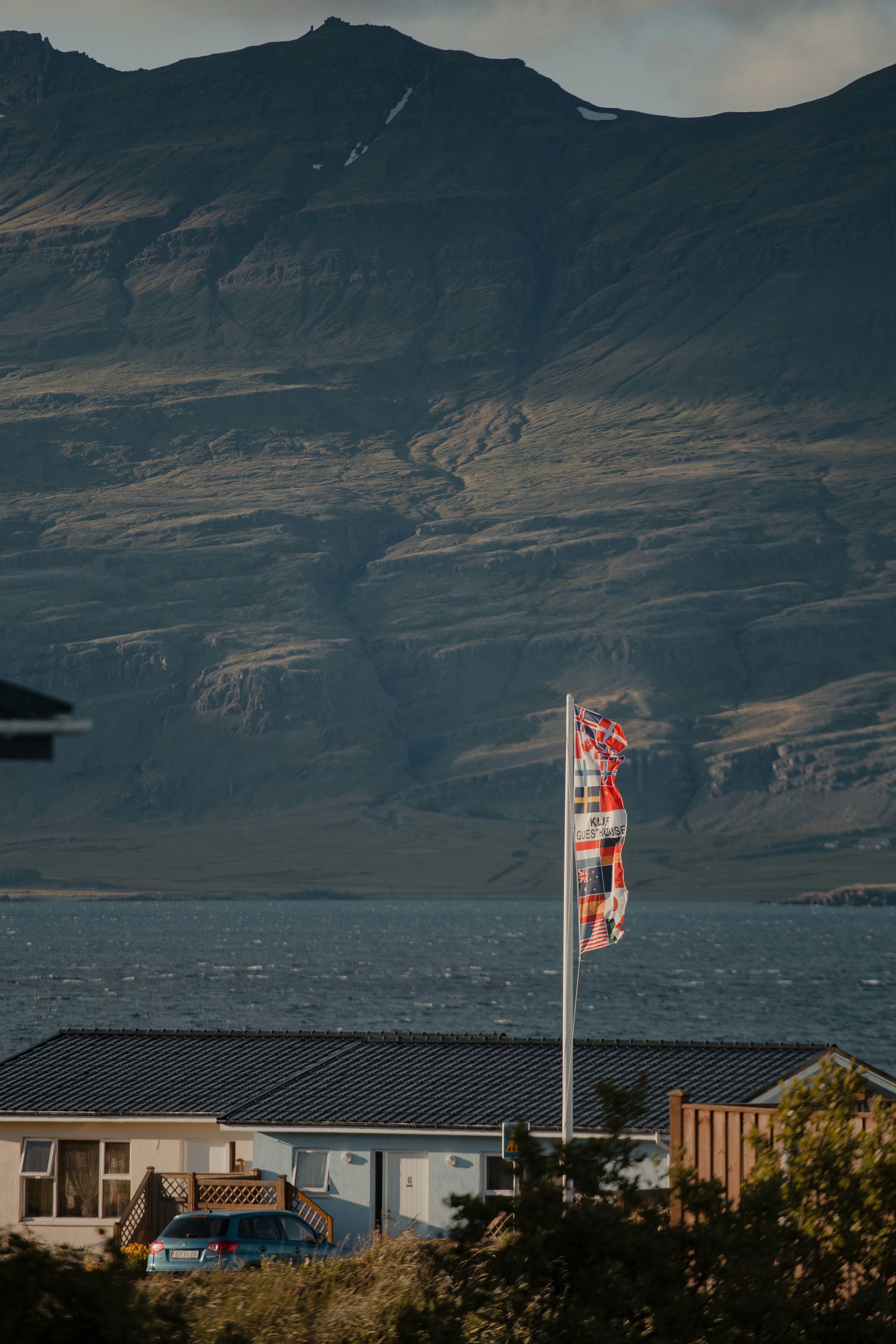 us a flag on top of brown rock mountain