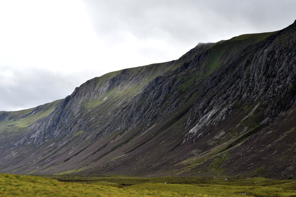 green and gray mountain under white sky during daytime