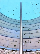 Close-up of a colorful pool strainer filled with leaves and debris.