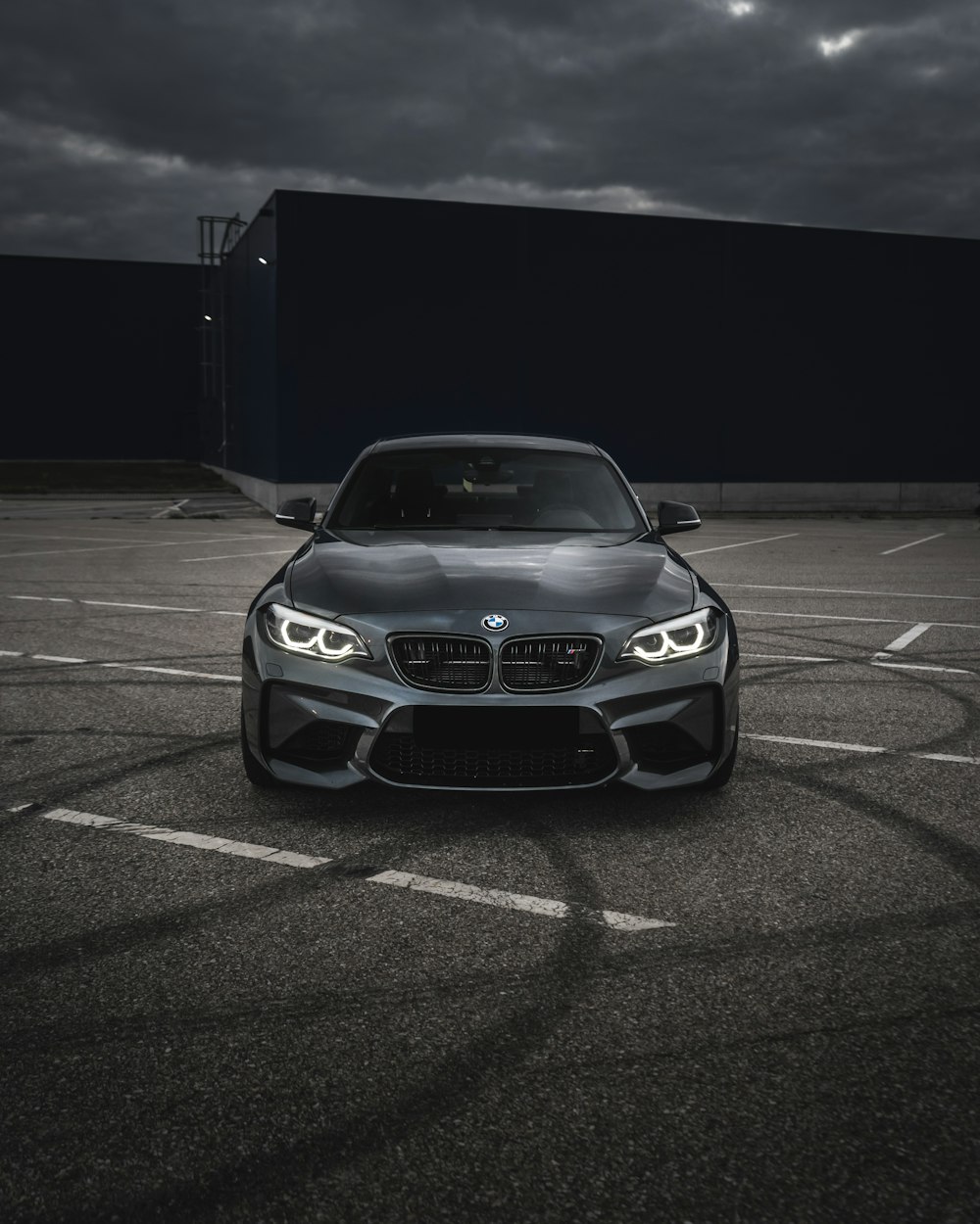 white bmw m 3 on parking lot